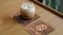 Cafe with logo engraved into custom coasters