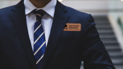 Custom engraved name tag on business man