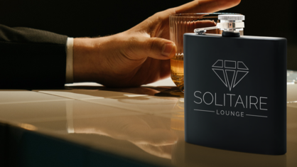 Lounge logo on custom engraved flask