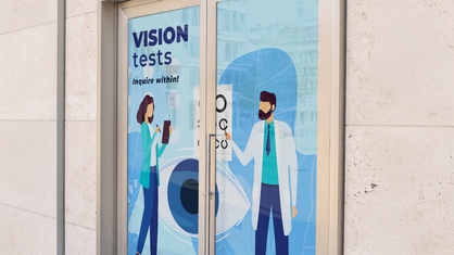Perforated sticker storefront display for optometrist
