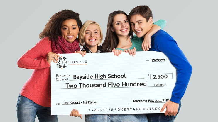 Students Holding Giant Check For 1st Place Prize