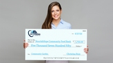 Woman holding Giant Check For Community Garden